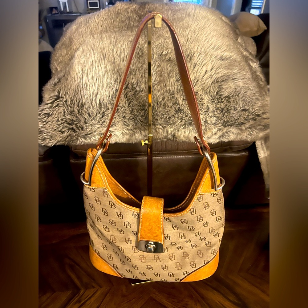 Dooney & Bourke beige canvas & vachetta leather shoulder bag.